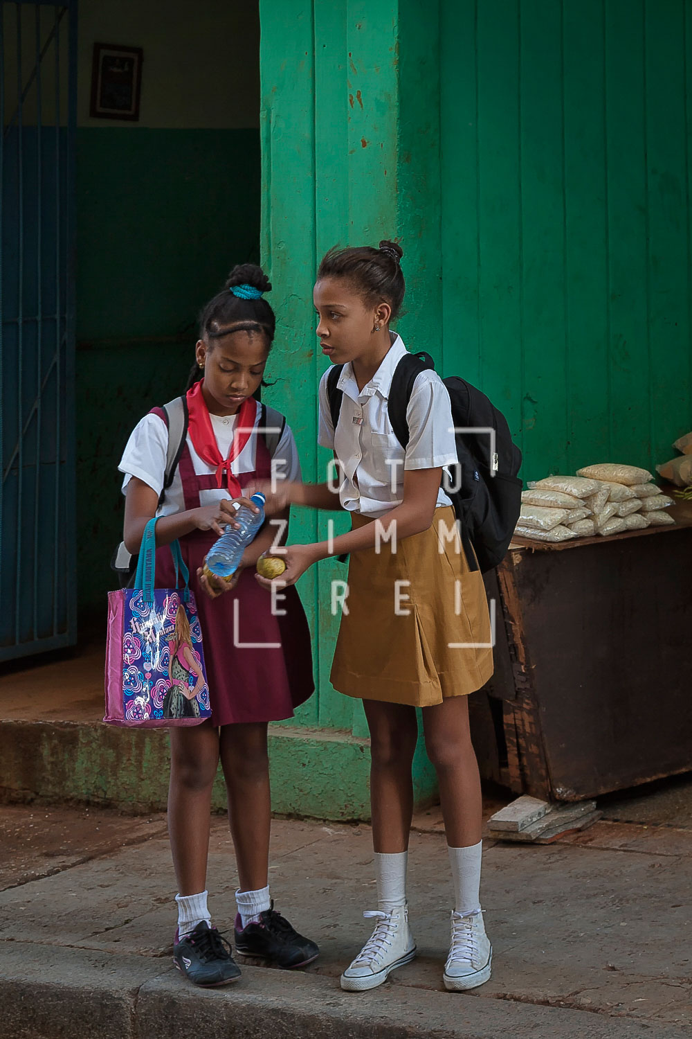 havanna street photoography two school girls chatting